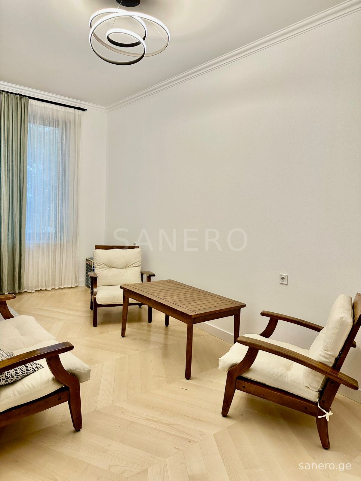 Living room with view toward the kitchen