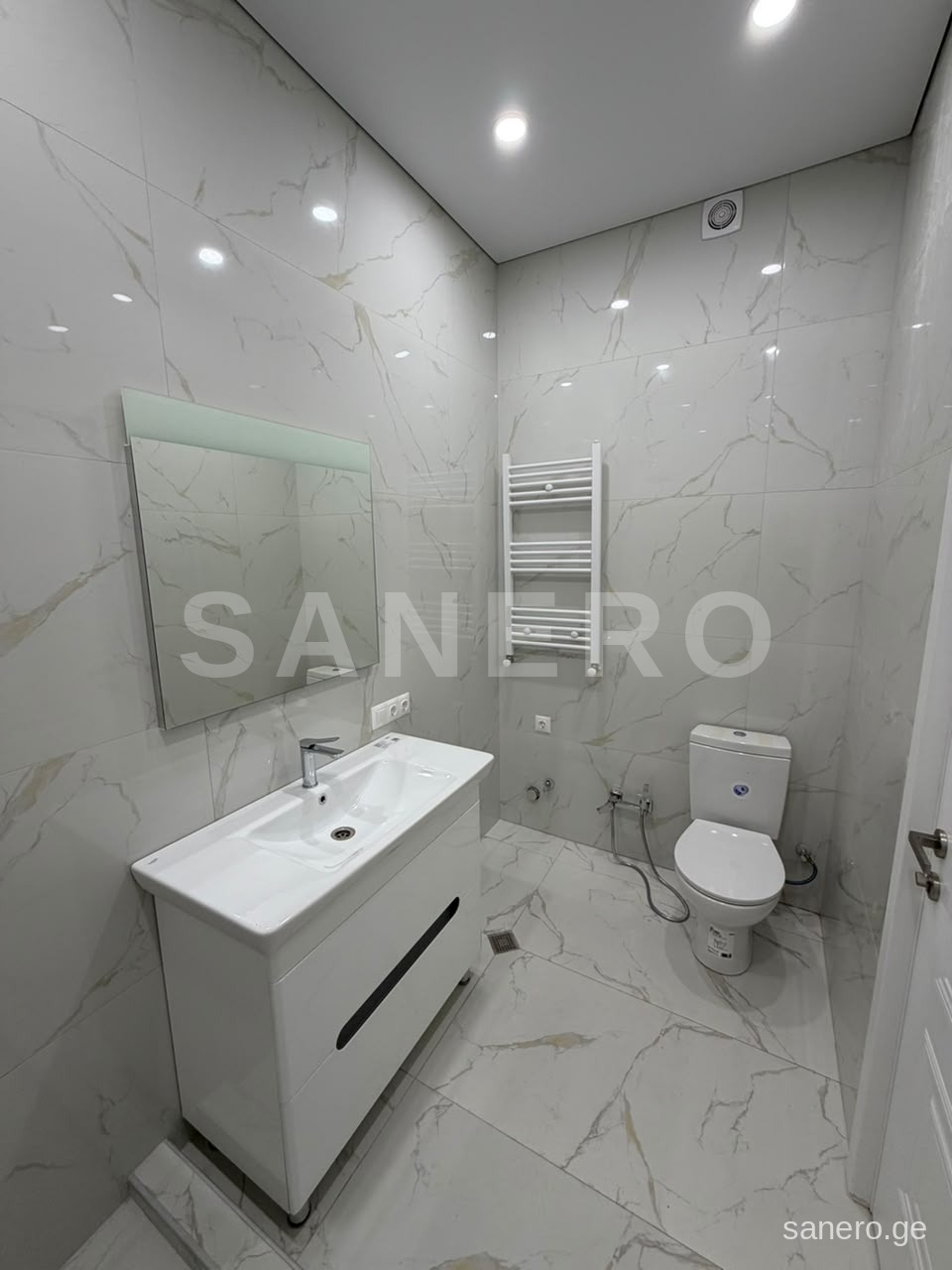 Bathroom with heated towel rail