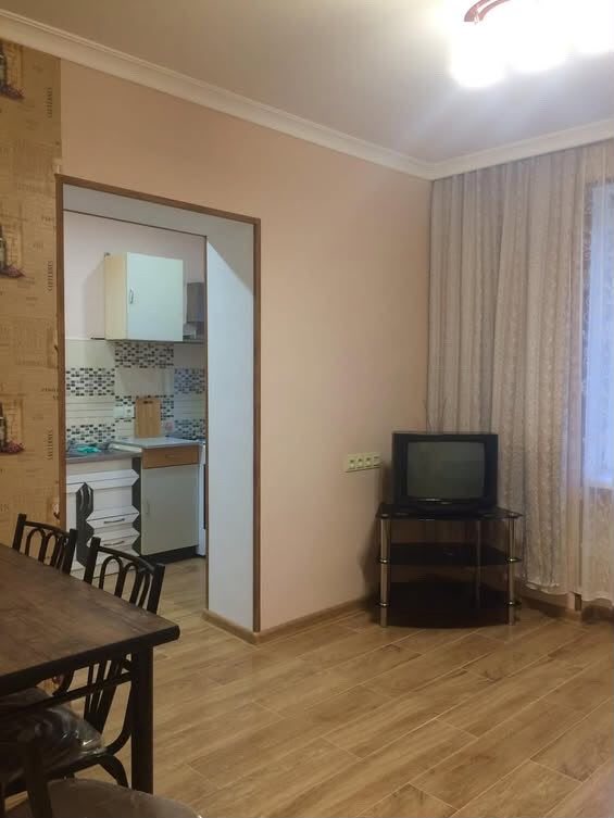 Living and dining room with kitchen doorway