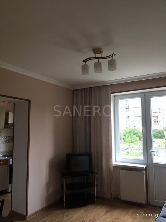 Room with window and balcony door