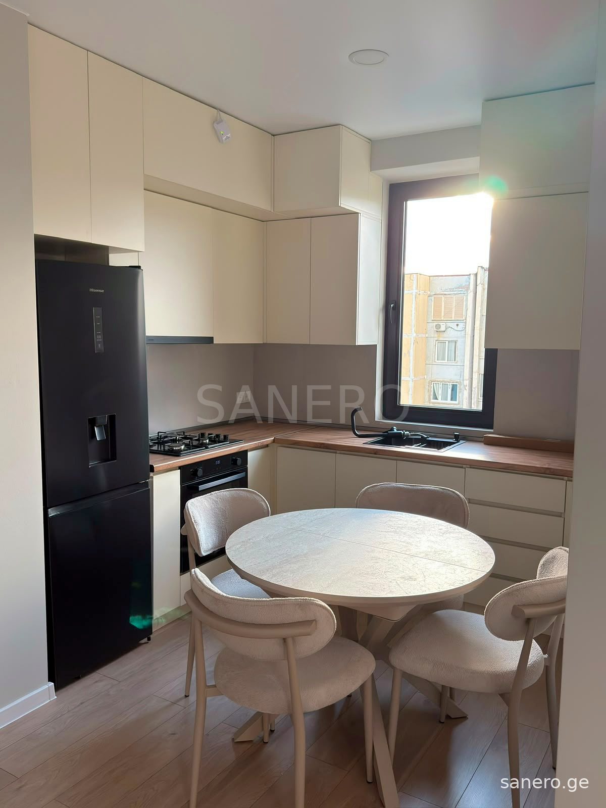 Kitchen with refrigerator, oven and gas cooktop