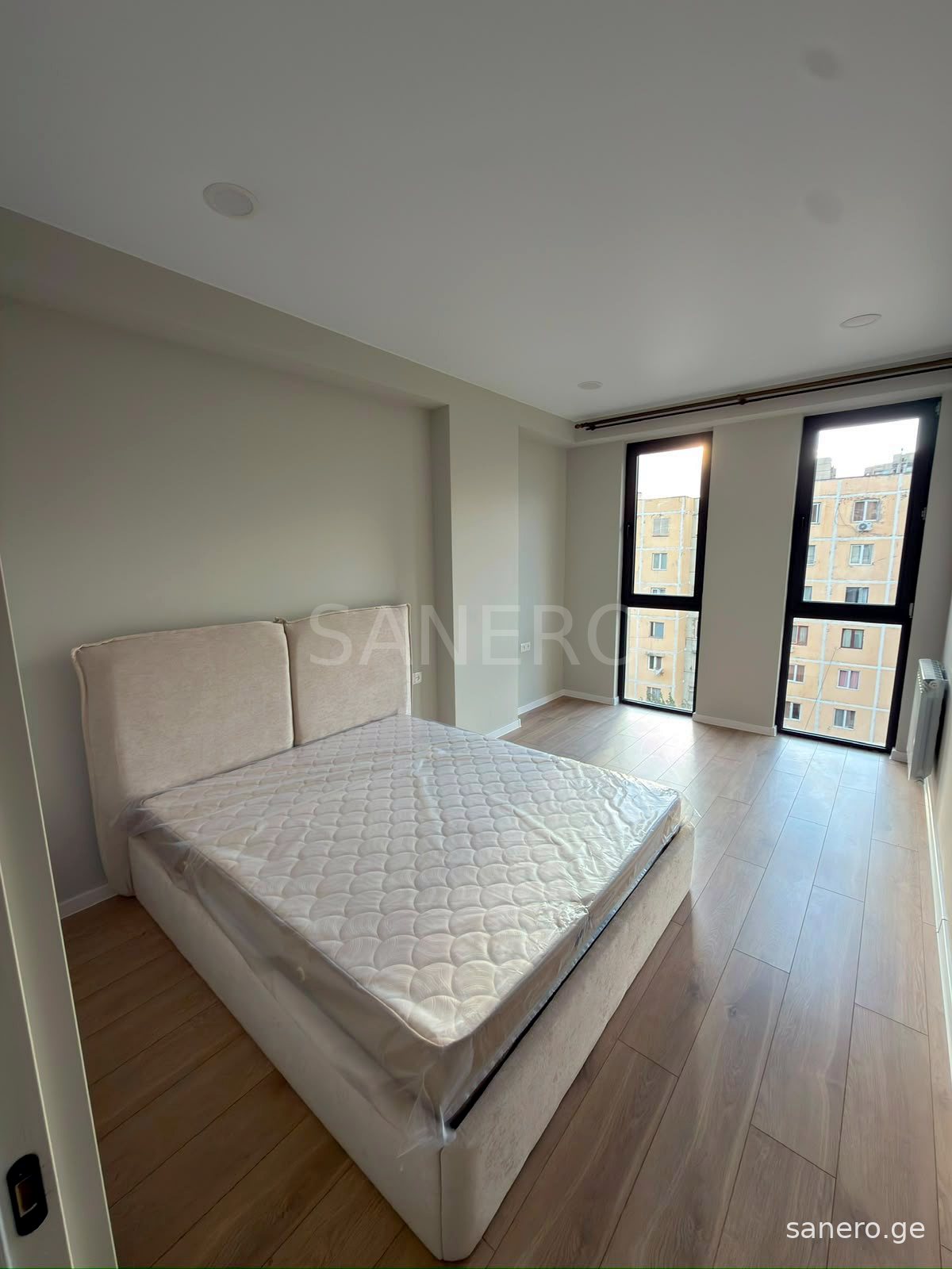 Bedroom with tall windows