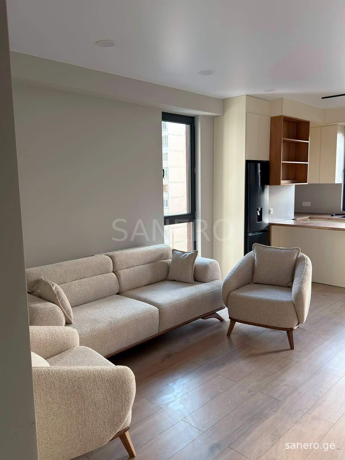 Living room with sofa and armchairs