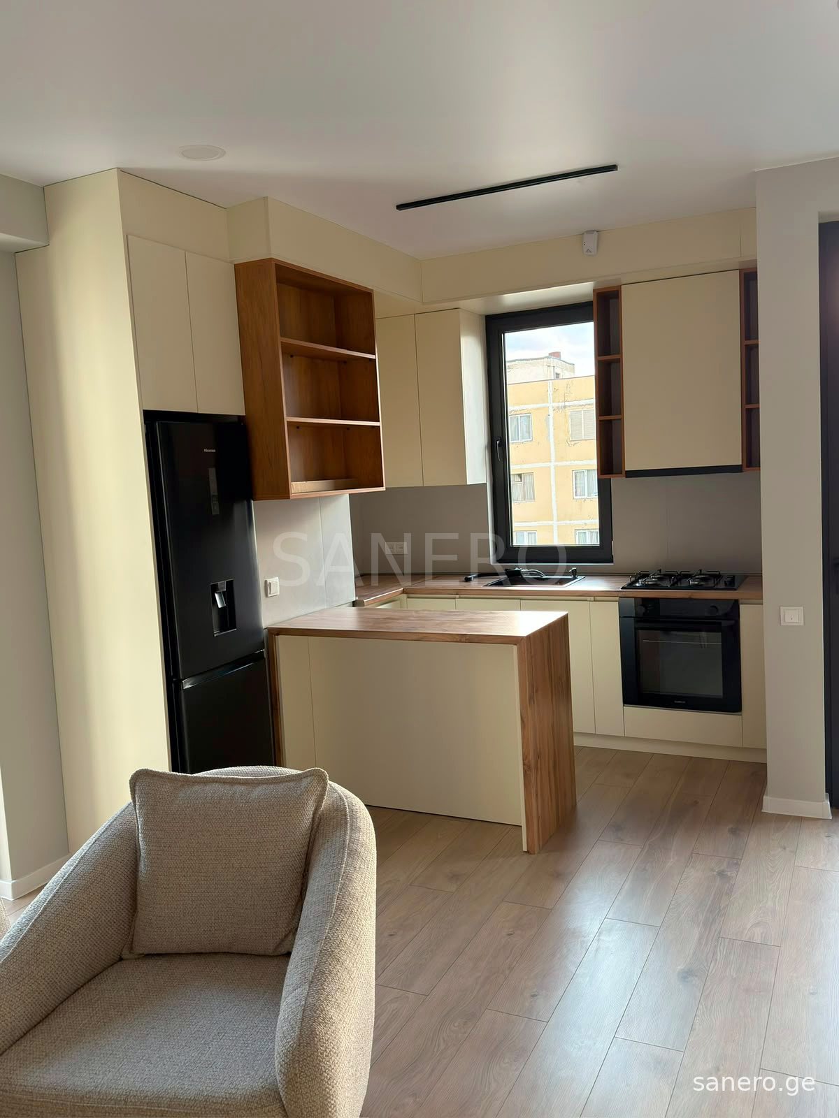 Kitchen with breakfast bar and refrigerator