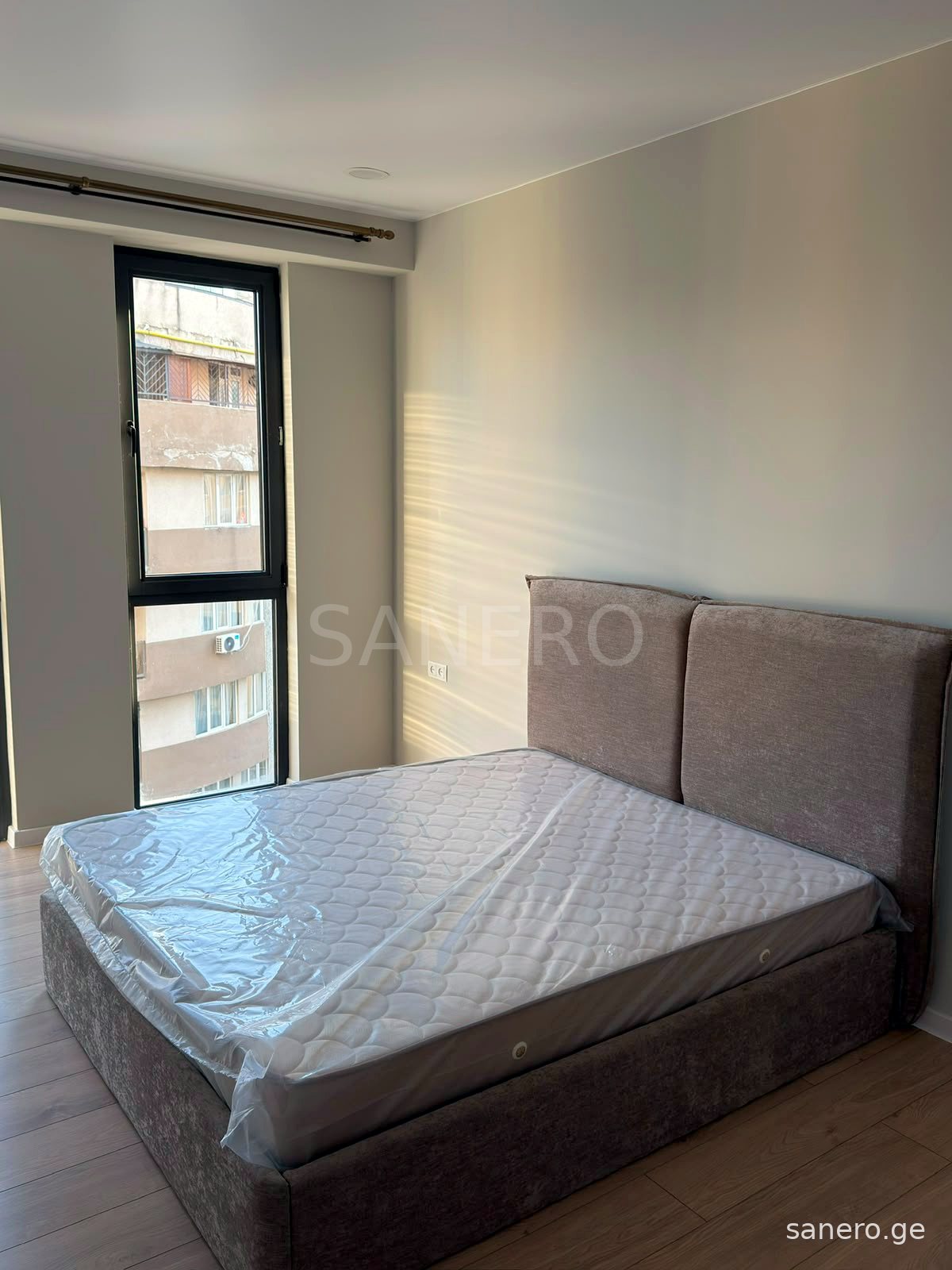 Bedroom with tall window