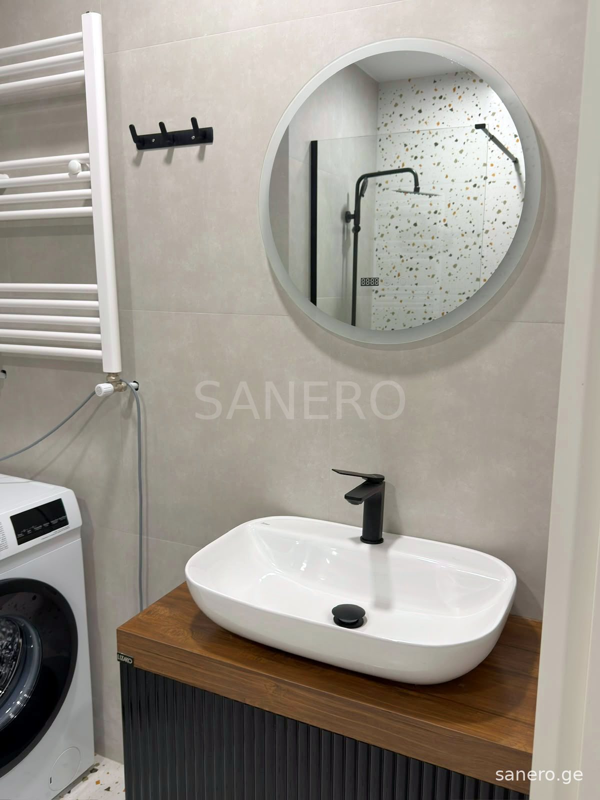 Washbasin with round LED mirror