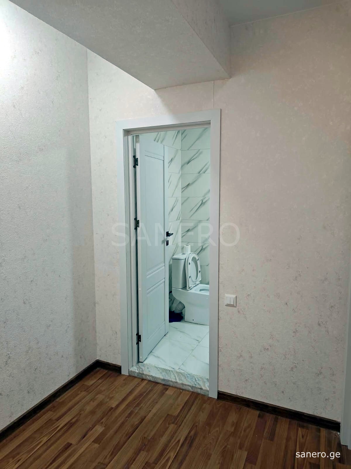 Hallway with door to the bathroom