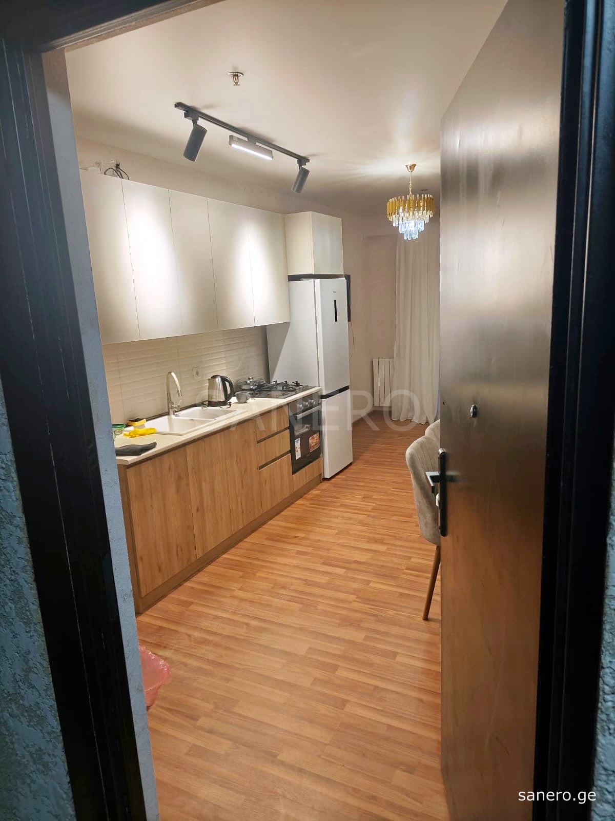 View from the entrance door into the kitchen and living room