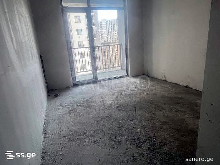 Living area with balcony door, unfinished
