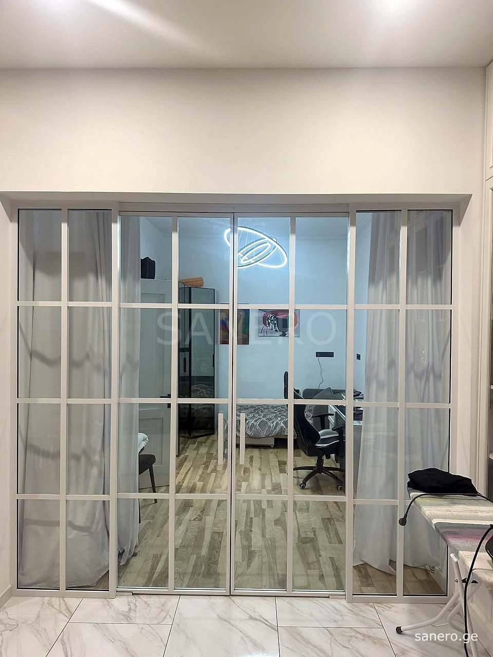 Glass partition doors to the second bedroom